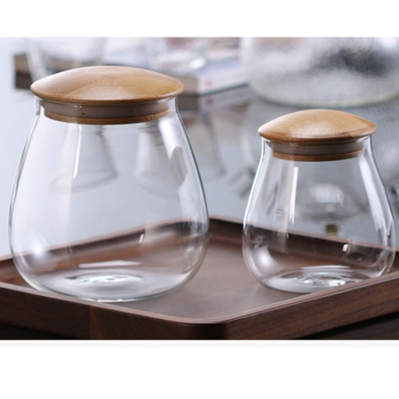 Keukenopbergpot van glas in paddenstoelvorm voor grove granen, met verzegelbare deksel, geschikt voor thee en koffiebonen. 